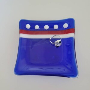 Fused glass art small dish for rings and things. Made with cobalt blue glass with a red and white accents fused glass on this 4.5” ring dish