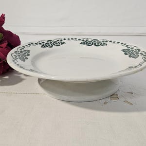 Footed plate in old earthenware, &quot;Nantes&quot; model, from the French manufacturer HBCM