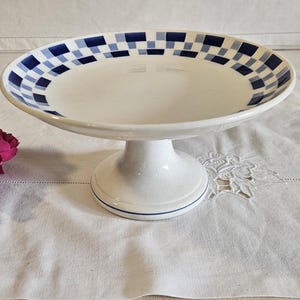 Antique earthenware footed plate, &quot;Lily&quot; model, from the French manufacturer of Saint Amand