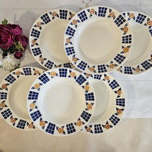 May include: Set of six white ceramic soup bowls with blue and gold floral designs. The bowls have a scalloped edge and are perfect for serving soup or salad.