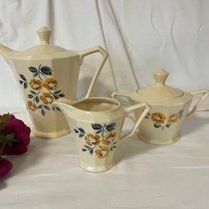 Vintage coffee service in old earthenware floral model of the French manufacture of Digoin