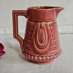 Old jug or pitcher in slip