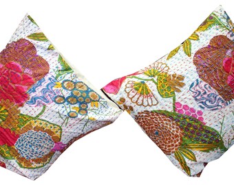 May include: Two white cotton pillow covers with a floral pattern. The pattern features pink, red, green, blue, and brown flowers and leaves. The pillows are quilted and have a white background.