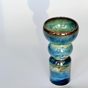 Ceramic bowl on foot.
