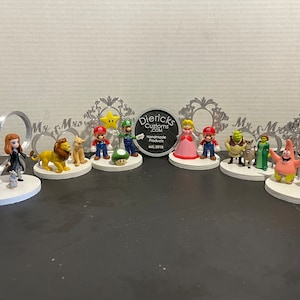 Action figure wedding cake toppers.