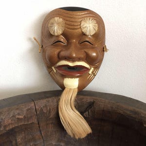 Máscara japonesa antigua, cerámica Okina Noh