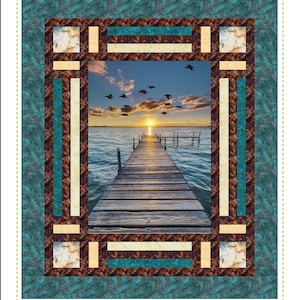 May include: A quilt pattern called "Cubbies" with a sunset scene over a lake and a wooden dock. The pattern is a pieced panel quilt with a teal, brown, and cream color scheme. The text "Quilting Renditions" is at the bottom of the image.