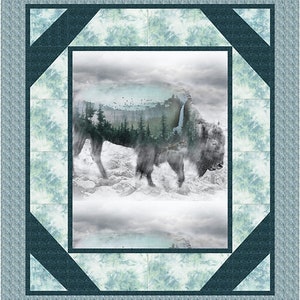 May include: A framed print of a bison standing in a snowy landscape. The bison is made up of a forest scene, with trees and a waterfall. The print has a blue and white border.