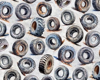May include: A repeating pattern of various tires in shades of gray, brown, and black, set against a light gray background. The tires vary in size and tread design, creating a textured and industrial aesthetic. The image includes a ruler at the bottom.
