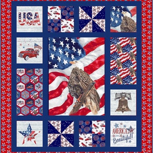 May include: A patriotic quilt with a red, white, and blue color scheme. The quilt features a bald eagle, an American flag, a Liberty Bell, a pickup truck, and the words "USA" and "America the Beautiful!"