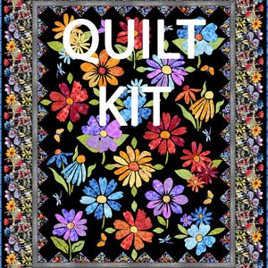 May include: A colorful quilt kit featuring a black background with vibrant floral designs in shades of red, orange, yellow, blue, and purple. The words "QUILT KIT" are displayed in white. The quilt has a floral border.