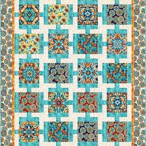 May include: A quilt with a white background and a grid of 16 colorful squares. The squares feature a variety of patterns, including floral, geometric, and paisley designs. The quilt is framed by a border of small circles.