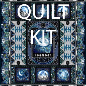 May include: A quilt kit with a celestial theme, featuring a large central design with the word "KIT" and "QUILT" in white. The quilt has a dark blue and teal color scheme with images of the moon, butterflies, and stars. The border includes the text "LA LUNA".