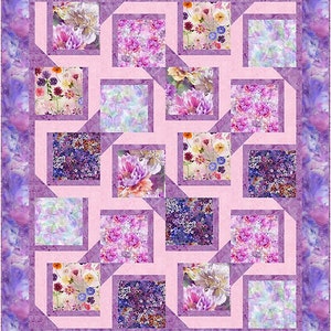 May include: A pink and purple quilt with a geometric pattern of squares and diamonds. The quilt is made of floral fabric with a variety of colors and patterns.