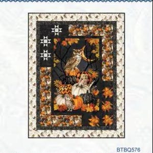 May include: A quilt with a fall theme, featuring owls, pumpkins, and autumn leaves. The central panel showcases a detailed scene with an owl perched on pumpkins, surrounded by fall foliage. The quilt has a black background with a decorative border.