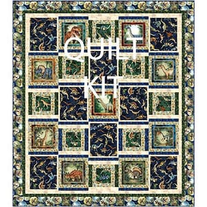 May include: A dinosaur-themed quilt kit with a repeating pattern of framed dinosaur illustrations on a navy blue background. The quilt has a green and cream border with the text "QUILT KIT" in the center.