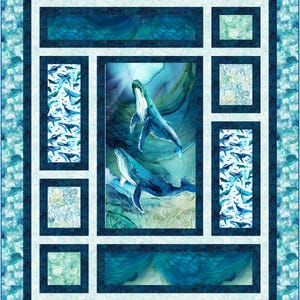 May include: A blue and white quilt featuring a central image of two whales swimming underwater. The quilt has a rectangular design with a border of various aquatic patterns, including whales and coral. The color palette is primarily shades of blue and white.
