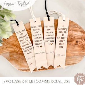 May include: Four wooden bookmarks with quotes and attached cords. The bookmarks have phrases like "Thank you for helping me write this chapter" and "A father's love is the greatest story ever told." The words "Laser Tested" are at the top.