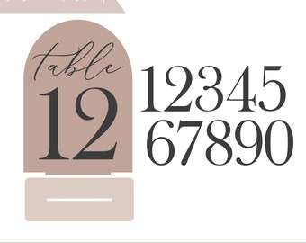 May include: A digital file for laser cutting table numbers for a wedding or event. The file includes numbers 1 through 10 and the word "table" in a script font. The numbers are in a black font on a light brown background.