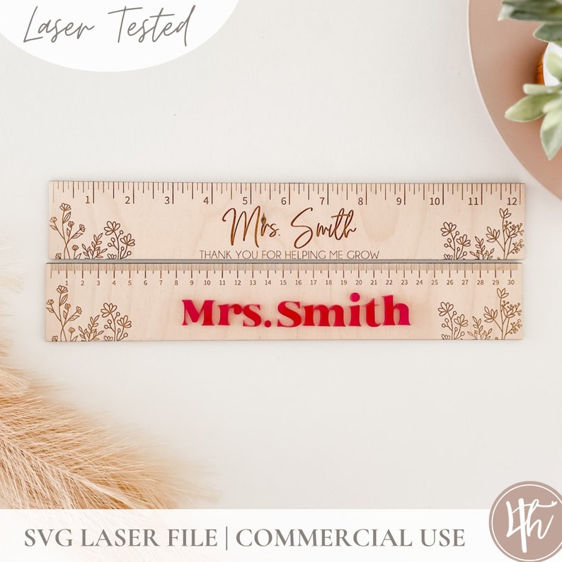 May include: A wooden ruler with a floral design and the text "Mrs. Smith" and "Thank you for helping me grow". The ruler is 12 inches long and has markings for inches and centimeters.