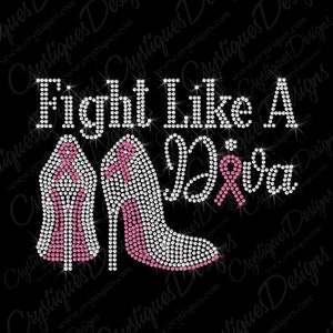 May include: Rhinestone design featuring two high-heeled shoes with pink accents and a pink ribbon. The design reads "Fight Like A Girl".