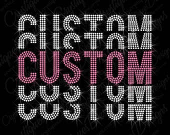 May include: The word "CUSTOM" is spelled out three times in rhinestones. The first two times the word is spelled out in clear rhinestones, and the third time the word is spelled out in pink rhinestones.