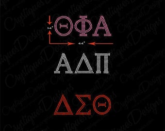 May include: A digital design template for a sorority or Greek organization. The design features the letters "ΘΦΑ", "ΑΔΠ", and "ΔΣΘ" in a bling font, created using 6ss (2.0mm) rhinestones. The letters are pink, white, and red, respectively.
