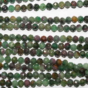 May include: Multiple strands of faceted gemstone beads in green, burgundy, and brown hues. The beads are round and polished. The beads are strung together, ideal for jewellery making, with each bead approximately 0.6 cm in diameter.