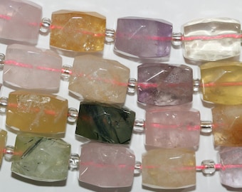 May include: A strand of faceted gemstone beads in various colors, including pink, yellow, green, and purple. The beads are strung on a clear thread with silver spacers.