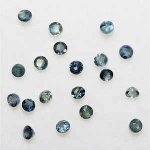 Lot de saphirs bleu verdâtre rondes à facettes 2.5mm.- Lot de 2 carats - Réf.333LO