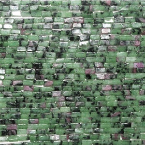 May include: A strand of green, black, and pink gemstone beads. The beads are rectangular and have a polished finish.