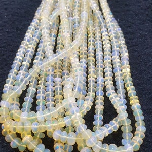 16&quot; St Ethiopian Opal Graduated Smooth Rondelle Beads 3x2-6x4mm.-Strand 40cm.