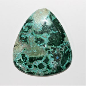 May include: A green and blue gemstone cabochon with a swirling pattern. The stone is cut in a teardrop shape and has a polished finish.