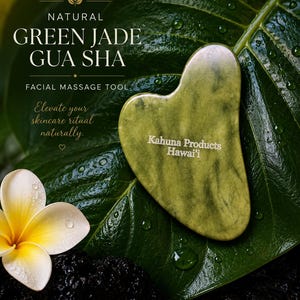 May include: A heart-shaped green jade gua sha facial massage tool with the text Kahuna Products Hawai'i printed on the surface. The text NATURAL GREEN JADE GUA SHA FACIAL MASSAGE TOOL and Elevate your skincare ritual naturally. are also visible.
