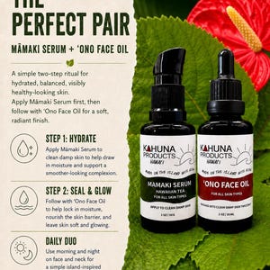 May include: Two black bottles of Kahuna Products skincare products, Mamaki Serum and 'Ono Face Oil, are displayed on a green leaf background. The bottles have white labels with black text. The text on the label reads "Made on the Island with Aloha".