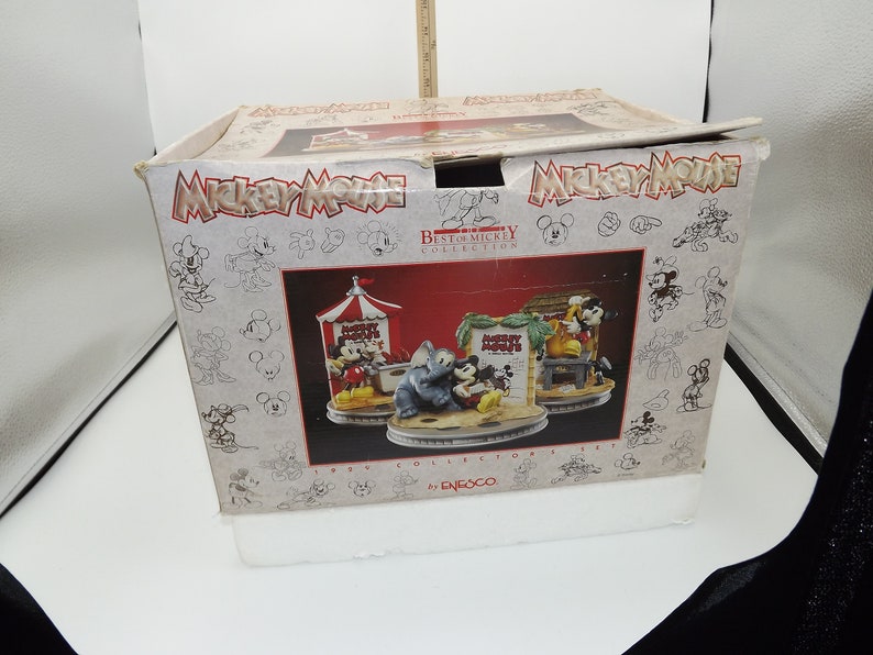 May include: A boxed set from the "Best of Mickey Collection" featuring three figurines with Mickey Mouse and friends. The box has the Mickey Mouse logo and sketches of Mickey. The set is from 1996 by Enesco.