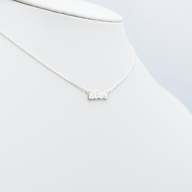 This name necklace is perfect personalized gift for your loved one. A beautiful and dainty script gives this necklace a timeless feel.  The nameplate and rolo chain are made with solid sterling silver and it comes in silver or gold finish.