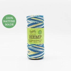 May include: A spool of hemp cord with blue, yellow, and white stripes. The label reads "HEMP 100% Natural Hemp Cord 205FT - 62.5m - 1mm" and "100% NATURE MADE". The product is for arts and crafts.