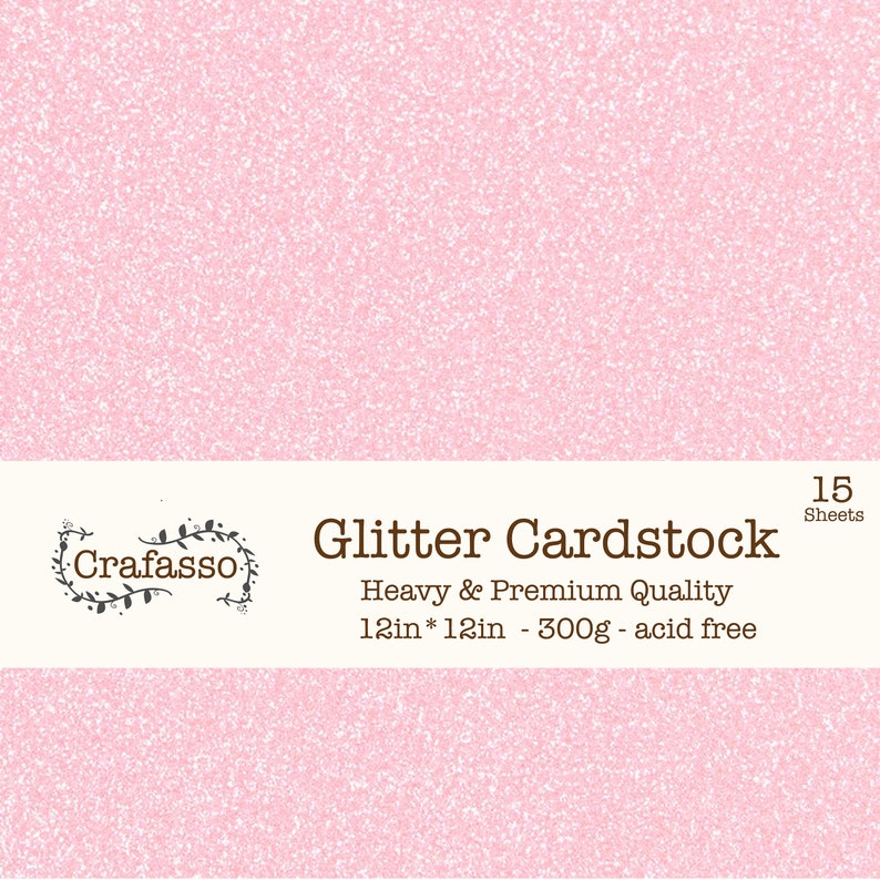 May include: Pink glitter cardstock with a sparkling texture. The product features the text "Glitter Cardstock" and "Heavy & Premium Quality". Each sheet measures 12 inches by 12 inches and is 300g. The package contains 15 sheets.