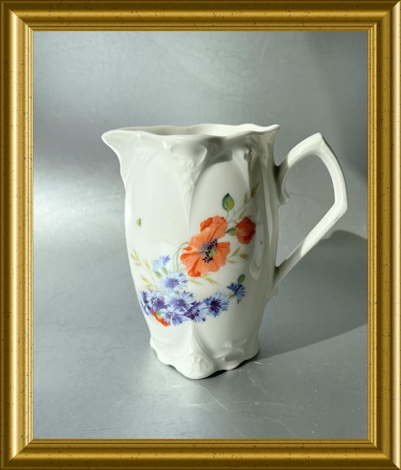 Art nouveau porcelain jug with floral decoration