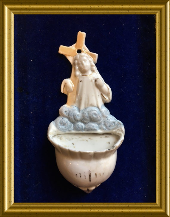 Antique porcelain holy water font: child with cross