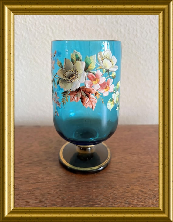 Antique blue glass with enamel painted flower decoration