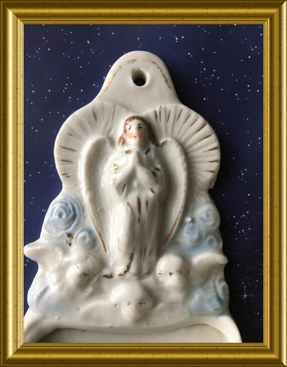 Antique porcelain holy water font: angel