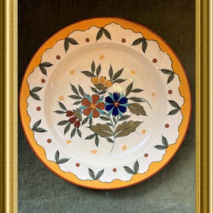 Op de afbeelding: Een set van drie keramische nestkommen in blauwe, groene en witte tinten. De kommen hebben een gespikkelde glazuur en een eenvoudig, modern ontwerp. De grootste kom heeft een diameter van ongeveer 15 cm.