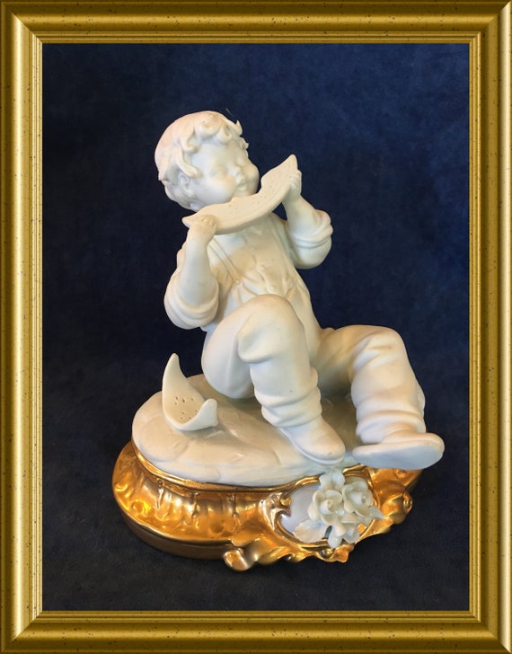 Edoardo Tasca Capodimonte porcelain figurine: boy with melon