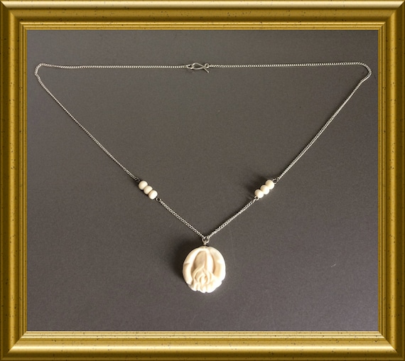 Silver necklace with hand carved rose