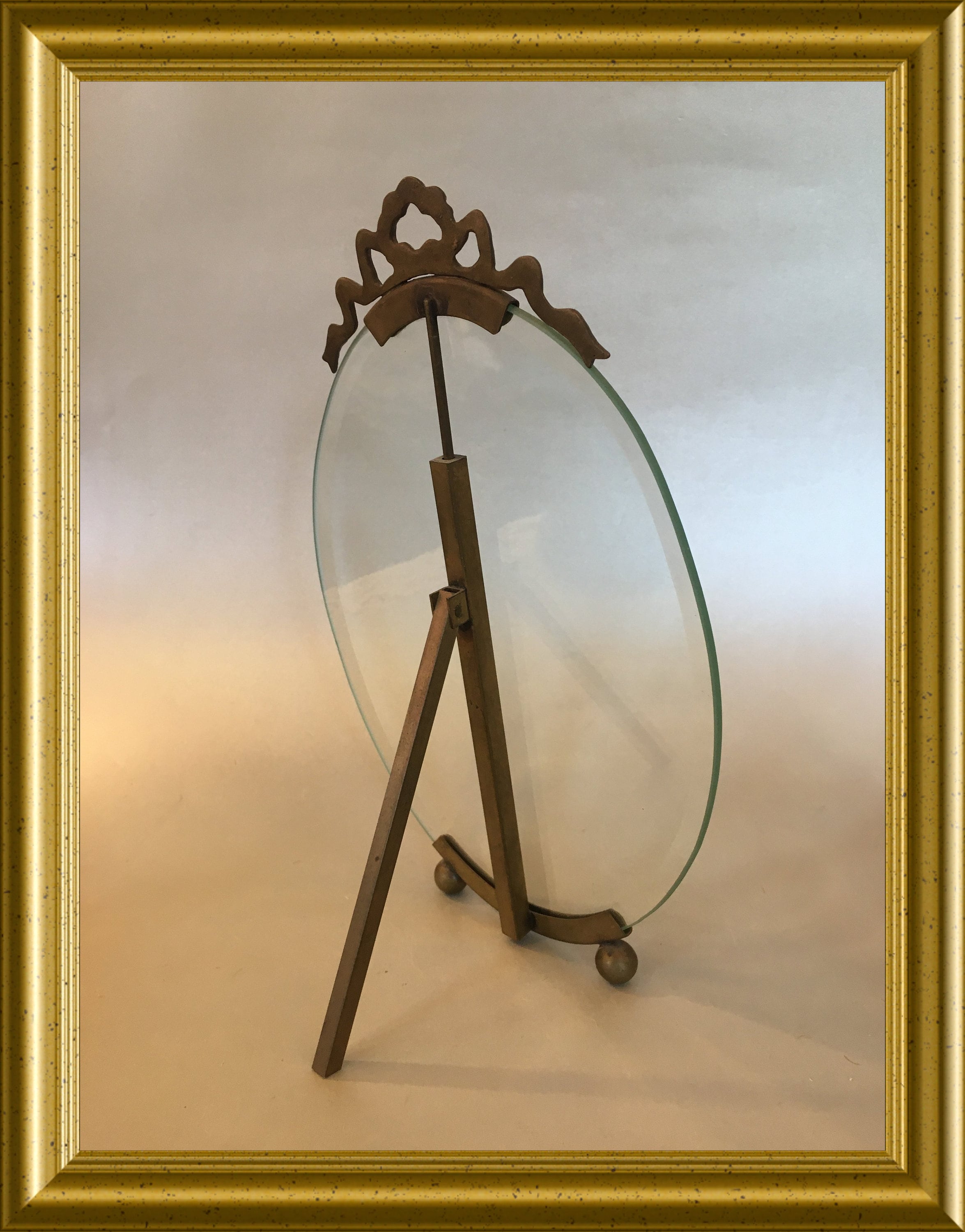 Antique large oval picture frame with beveled glass and bow