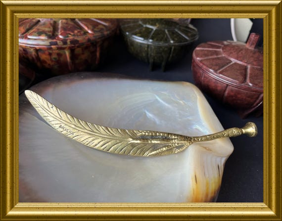 Vintage brass letter opener: claw, feather