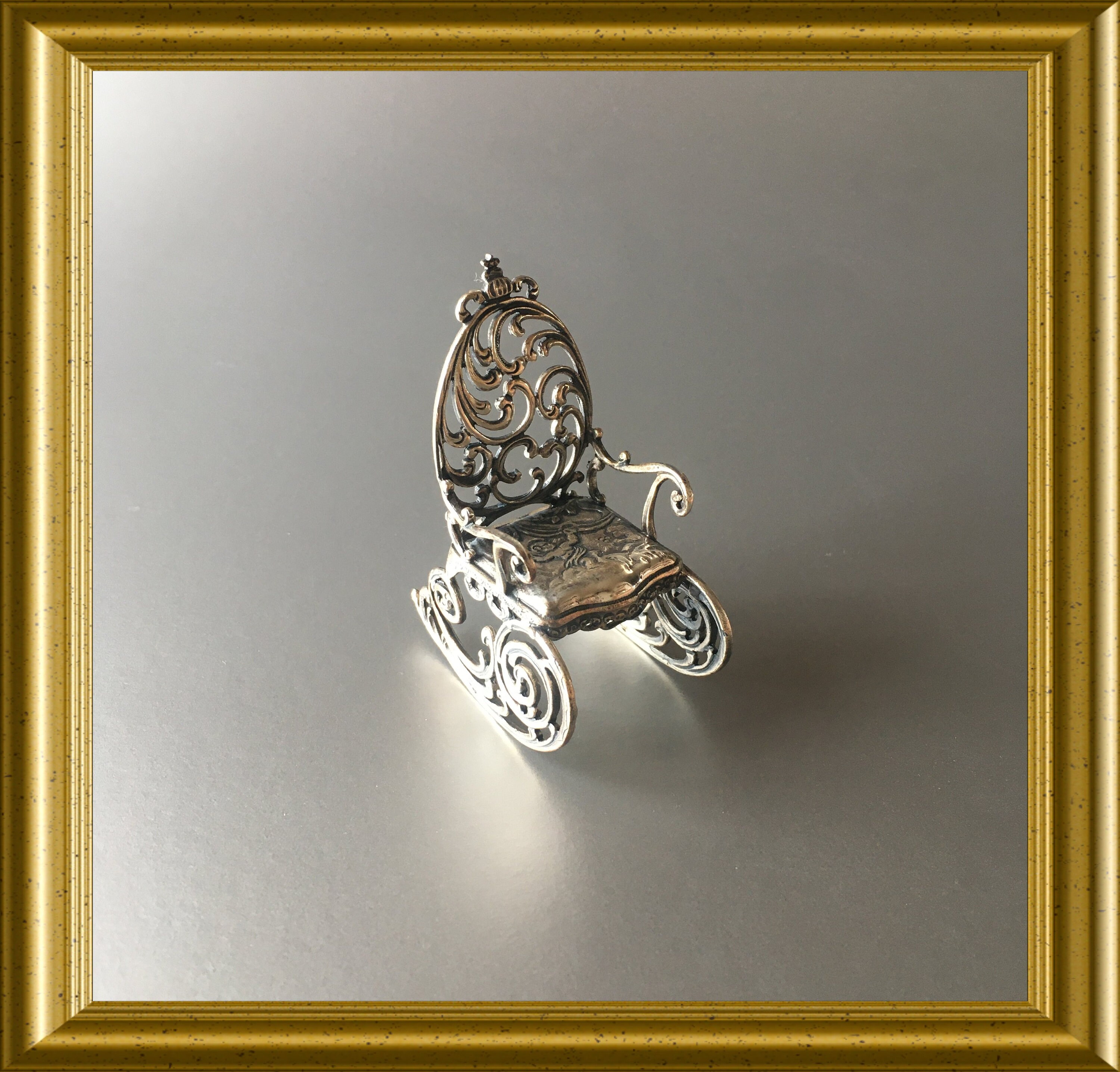 Miniature silver rocking chair with angel decoration: Kuehn sterling