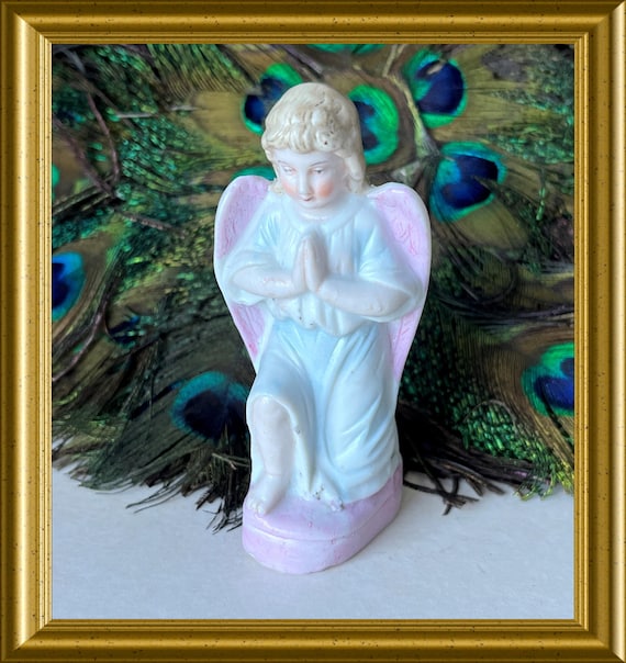 Antique bisque porcelain figurine: kneeling angel